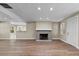 Inviting living room with brick fireplace, new floors, and plenty of space at 103 S Flagler Ave, Edgewater, FL 32132