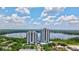 Two modern condo towers overlook the lake, gardens, a tiki bar, and a volcano themed putt-putt course at 13427 Blue Heron Beach Dr # 2106, Orlando, FL 32821