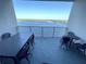 Spacious balcony with seating offers panoramic water views, perfect for relaxing and entertaining at 13427 Blue Heron Beach Dr # 2106, Orlando, FL 32821