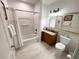 Clean bathroom with a shower-tub combo, granite countertop vanity, and modern fixtures at 13427 Blue Heron Beach Dr # 2106, Orlando, FL 32821