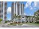Stunning condominium building with manicured landscaping and a beautiful fountain at the entrance at 13427 Blue Heron Beach Dr # 2106, Orlando, FL 32821