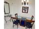 Elegant dining room with modern table and chairs, enhanced by stylish mirror and chandelier at 13427 Blue Heron Beach Dr # 2106, Orlando, FL 32821
