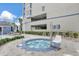 Relaxing hot tub with surrounding seating in an outdoor oasis at 13427 Blue Heron Beach Dr # 2106, Orlando, FL 32821