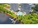 Aerial view of a lagoon style pool, sun loungers and lake access from the condo building at 13427 Blue Heron Beach Dr # 2106, Orlando, FL 32821