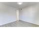 Bedroom with light gray wood-look floors and neutral paint at 2735 N Poinciana Blvd # 103, Kissimmee, FL 34746
