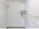 Walk-in closet with white wire shelving and light gray wood-look flooring at 2735 N Poinciana Blvd # 103, Kissimmee, FL 34746