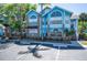 Inviting blue condo with decorative windows and convenient parking spaces at 2735 N Poinciana Blvd # 103, Kissimmee, FL 34746