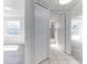 Open hallway showcasing the bathroom, bedroom, and living room, with neutral walls and flooring at 2735 N Poinciana Blvd # 103, Kissimmee, FL 34746