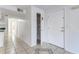 Bright hallway features tile floors, a coat closet and a white front door at 2735 N Poinciana Blvd # 103, Kissimmee, FL 34746