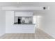 Well-lit kitchen featuring white cabinets and stainless steel appliances, perfect for cooking and entertaining at 2735 N Poinciana Blvd # 103, Kissimmee, FL 34746