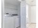 Convenient laundry room with washer and dryer included, featuring tiled floors and ample space at 2735 N Poinciana Blvd # 103, Kissimmee, FL 34746