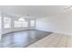 Spacious living room featuring wood floors and multiple windows for natural light, great for relaxing or entertaining at 2735 N Poinciana Blvd # 103, Kissimmee, FL 34746