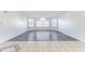 Bright living room with tile and wood flooring and multiple windows allowing ample natural light to enter at 2735 N Poinciana Blvd # 103, Kissimmee, FL 34746