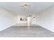 Open concept living space with tile flooring, wood flooring and a view of the kitchen at 2735 N Poinciana Blvd # 103, Kissimmee, FL 34746