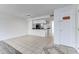 Open-concept living space featuring the kitchen with breakfast bar and tile floors at 2735 N Poinciana Blvd # 103, Kissimmee, FL 34746