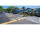 Exterior view of the parking lot, landscaping and the building at 2735 N Poinciana Blvd # 103, Kissimmee, FL 34746