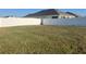 Large, fenced backyard with a spacious lawn at 357 Summershore Dr, Auburndale, FL 33823