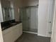Bathroom with granite counters, tiled floor, and a glass shower at 357 Summershore Dr, Auburndale, FL 33823