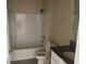 Clean and bright bathroom with a shower-tub combo and granite vanity at 357 Summershore Dr, Auburndale, FL 33823
