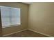 Cozy bedroom with a large window offering plenty of natural light and neutral carpet flooring at 357 Summershore Dr, Auburndale, FL 33823