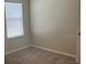 Bedroom with window and neutral carpet flooring at 357 Summershore Dr, Auburndale, FL 33823