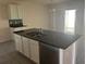 Kitchen island featuring granite countertop, stainless steel sink, and stainless steel dishwasher at 357 Summershore Dr, Auburndale, FL 33823
