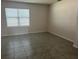 Living Room featuring Tile floors and a large window at 357 Summershore Dr, Auburndale, FL 33823