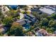 Aerial view of a stunning home with a pool, surrounded by mature trees in a desirable neighborhood at 1691 Chestnut Ave, Winter Park, FL 32789
