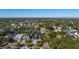 An aerial view showcasing a home nestled in a lush neighborhood with mature trees and manicured landscaping at 1691 Chestnut Ave, Winter Park, FL 32789
