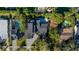 Aerial view of the property showcasing a private pool, lush landscaping, and the neighborhood at 1691 Chestnut Ave, Winter Park, FL 32789