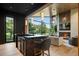 Stylish bar area with a marble countertop and backyard view at 1691 Chestnut Ave, Winter Park, FL 32789