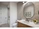 Well-lit bathroom featuring a modern vanity, decorative mirror, and stylish accents at 1691 Chestnut Ave, Winter Park, FL 32789