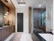 Sleek bathroom showcasing modern fixtures, stylish vanity, glass shower, and luxurious tub at 1691 Chestnut Ave, Winter Park, FL 32789