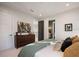 Spacious bedroom featuring a dresser and entry to the bathroom at 1691 Chestnut Ave, Winter Park, FL 32789