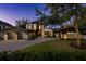 Beautiful modern two-story home with a manicured lawn, stone accents, and a spacious three-car garage at 1691 Chestnut Ave, Winter Park, FL 32789