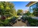 Cozy fire pit area surrounded by lush landscaping, perfect for outdoor gatherings and relaxation at 1691 Chestnut Ave, Winter Park, FL 32789