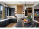 Modern kitchen with black cabinetry, marble countertops, and stainless steel appliances at 1691 Chestnut Ave, Winter Park, FL 32789
