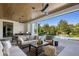 Outdoor living space with pool views, a dining table and outdoor kitchen at 1691 Chestnut Ave, Winter Park, FL 32789