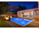 A stunning backyard with a pool, fire pit, and an open-air living space, perfect for entertaining at 1691 Chestnut Ave, Winter Park, FL 32789