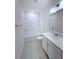 Bright bathroom with white subway tile, modern vanity, and a shower-tub combination at 3842 Knotty Pine St, St Cloud, FL 34772