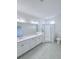 Modern bathroom features double vanity, a glass-enclosed shower, and elegant fixtures at 3842 Knotty Pine St, St Cloud, FL 34772