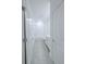 Bathroom featuring shower over tub with tiled surround, offering a clean and modern space at 3842 Knotty Pine St, St Cloud, FL 34772