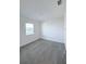 Neutral bedroom with a window view, comfortable carpeting, and a well-lit space at 3842 Knotty Pine St, St Cloud, FL 34772