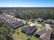 An aerial view highlights the property, the neighborhood, and the surrounding lush Florida landscape at 584 Aldenham Ln, Ormond Beach, FL 32174