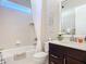 Elegant bathroom featuring a shower, white vanity with dark wood cabinets at 584 Aldenham Ln, Ormond Beach, FL 32174