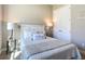 Cozy bedroom with neutral decor and carpet at 584 Aldenham Ln, Ormond Beach, FL 32174