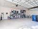 Spacious garage with ample storage, epoxy floor, and plenty of room for vehicles and equipment at 584 Aldenham Ln, Ormond Beach, FL 32174