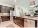 Open-concept kitchen with island, stainless appliances, and views into the living area at 584 Aldenham Ln, Ormond Beach, FL 32174