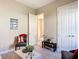Well-lit living area with decorative furniture and view of a hallway at 584 Aldenham Ln, Ormond Beach, FL 32174