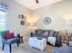 Cozy living room featuring neutral colors, stylish decor, and ample natural light at 584 Aldenham Ln, Ormond Beach, FL 32174